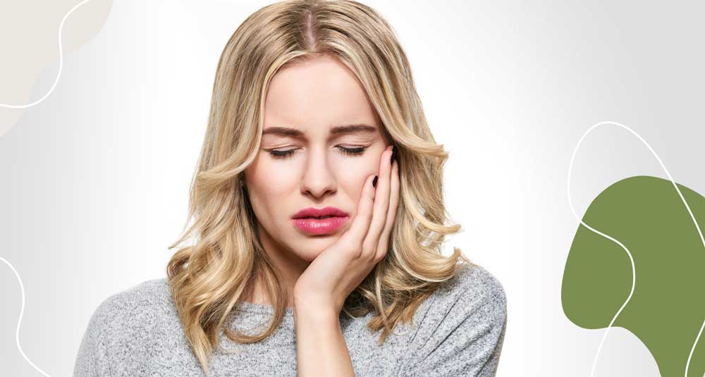 Woman Holding Jaw Needing Pain Relief