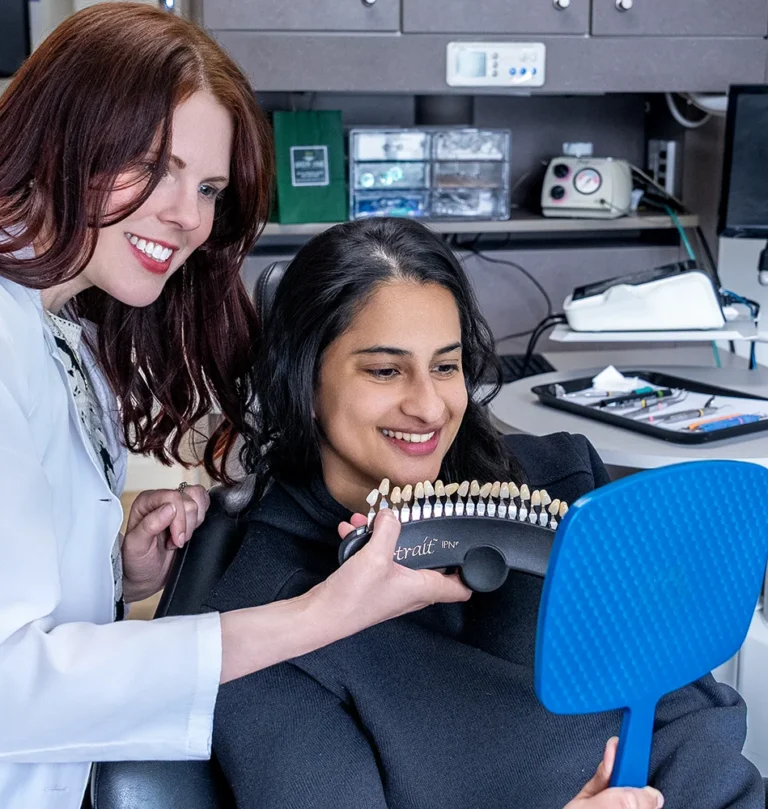 Dr. Ellison Admiring Patient Smile Makeover Results