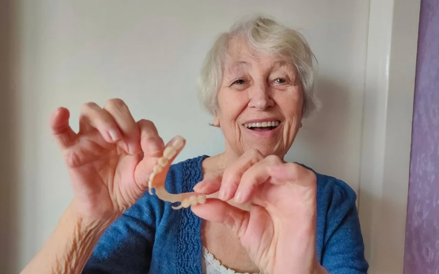 woman smiling with partial dentures